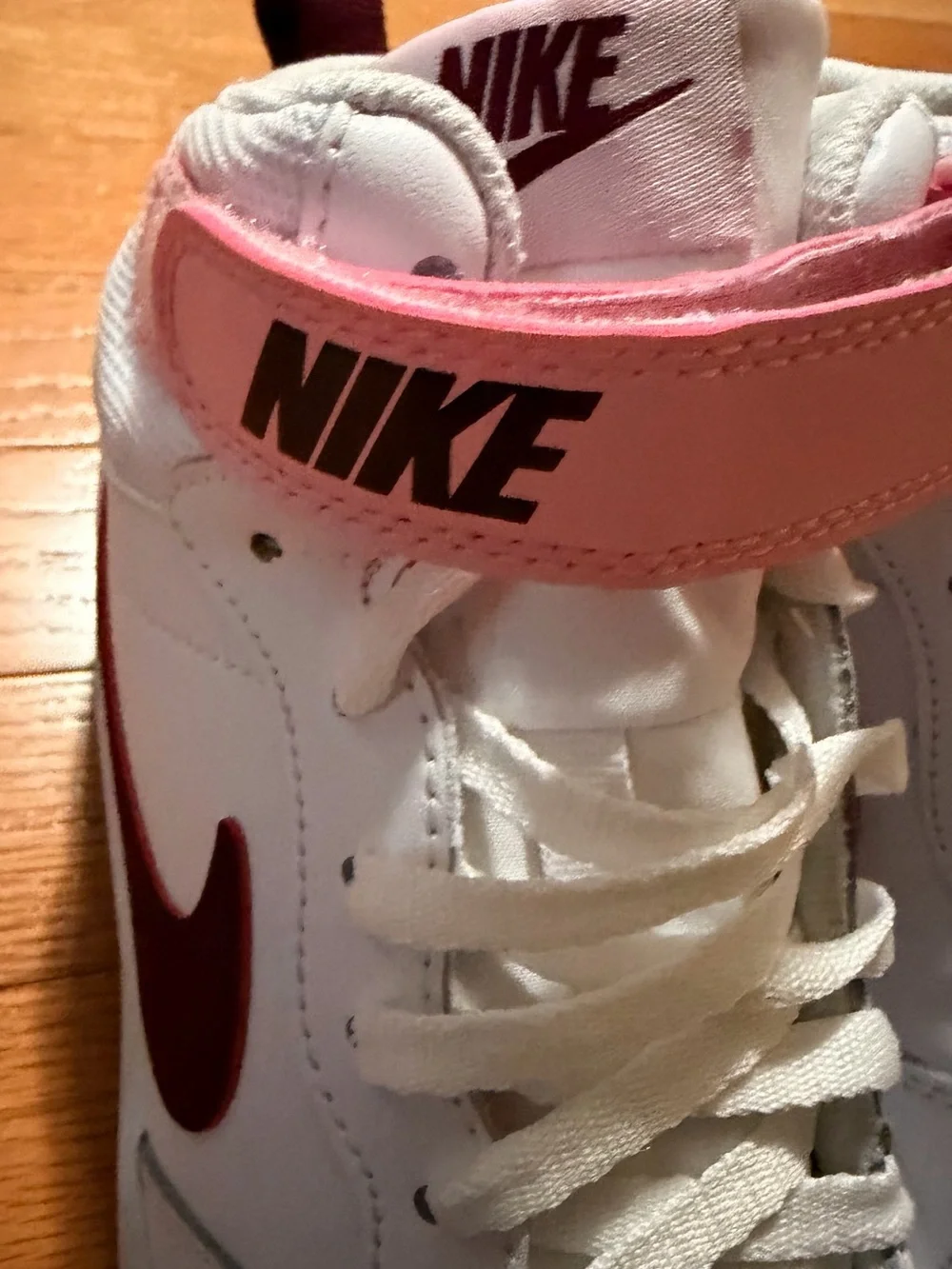 Kids Nike White High-Top Sneakers with Pink and Maroon Accents